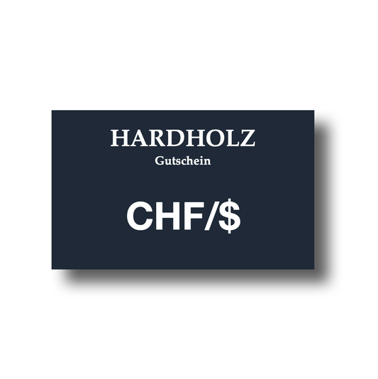 Geschenkkarte von HARDHOLZ in elegantem Schwarz mit Aufschrift 'Gutschein CHF/$'. Geschenkkarte – Perfekte Geschenke für jeden Anlass.
